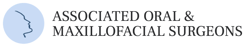 The image shows a logo with text that reads  Associate Dental   Maxillofacial Surgeons  above an illustration of a face profile, followed by the name  Maxillofacial Surgeons.